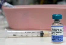 Studies Document Brain Swelling, Sepsis in U.S. Measles Outbreaks A photo of a vial of MMR vaccine.